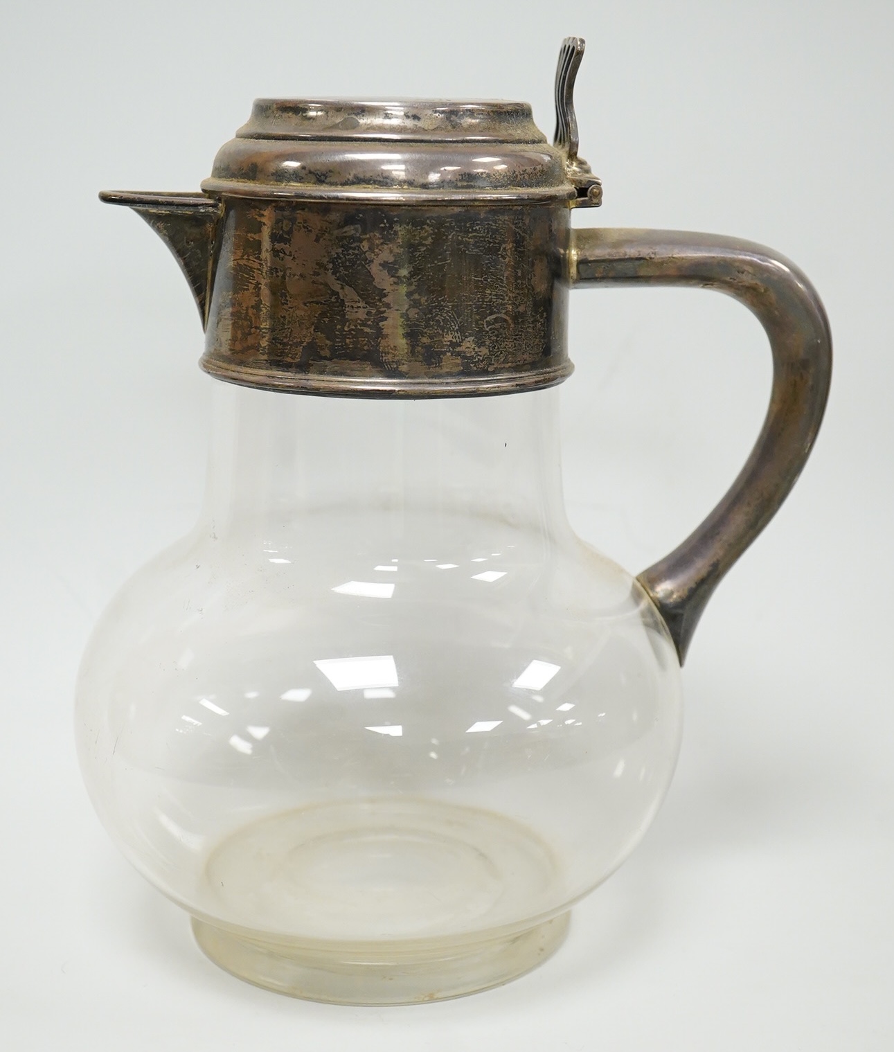 A late Victorian silver mounted plain glass bulbous claret jug, Richard Hodd & Son, London, 1880, height 19.7cm.